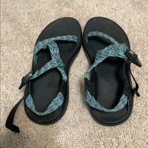 Black and teal Chacos